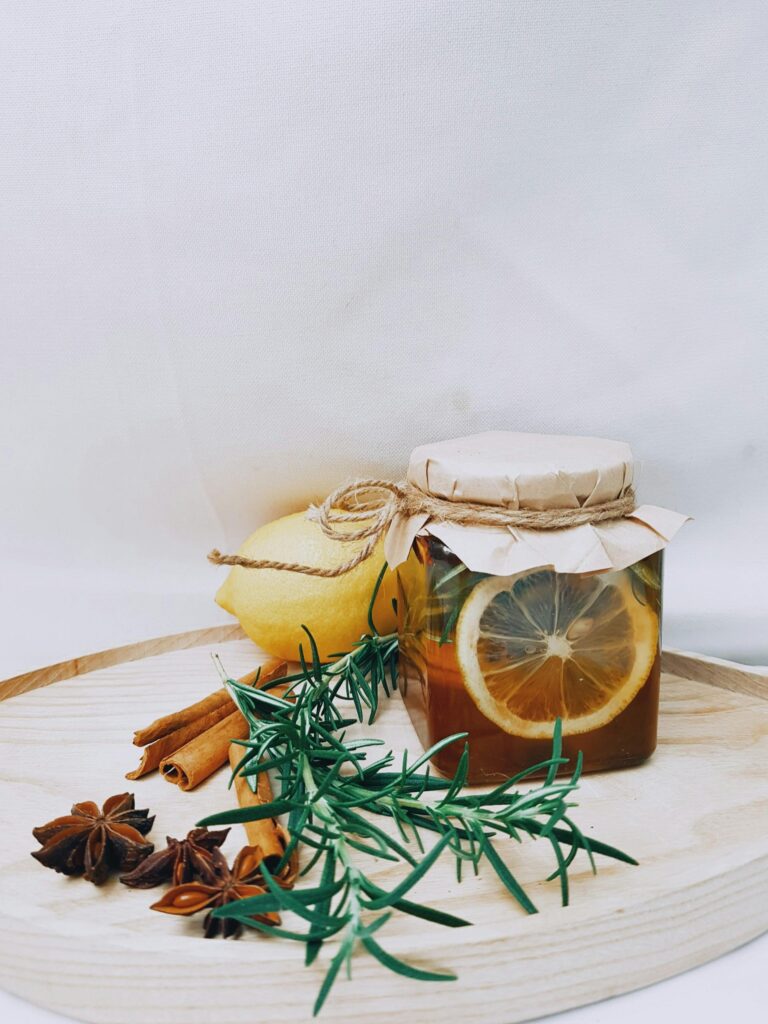 pexels photo 3273989 3273989 Artistic arrangement of lemon, herbs, and honey jar for DIY herbal tea.